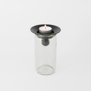 Ljushållare i gjutjärn med glasburk.