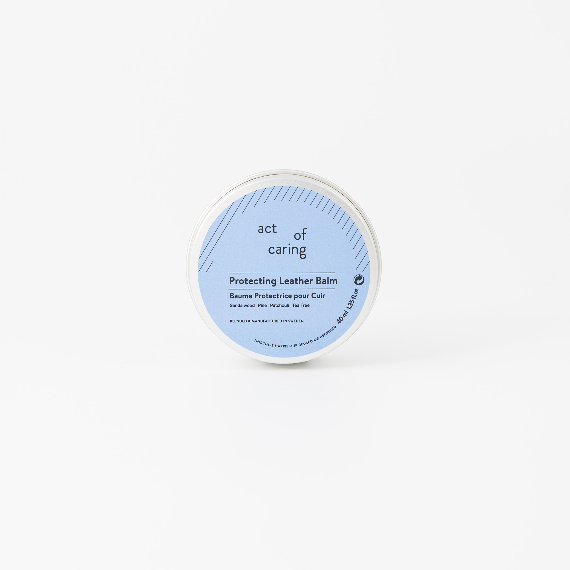 Metallburk med läderbalsam.